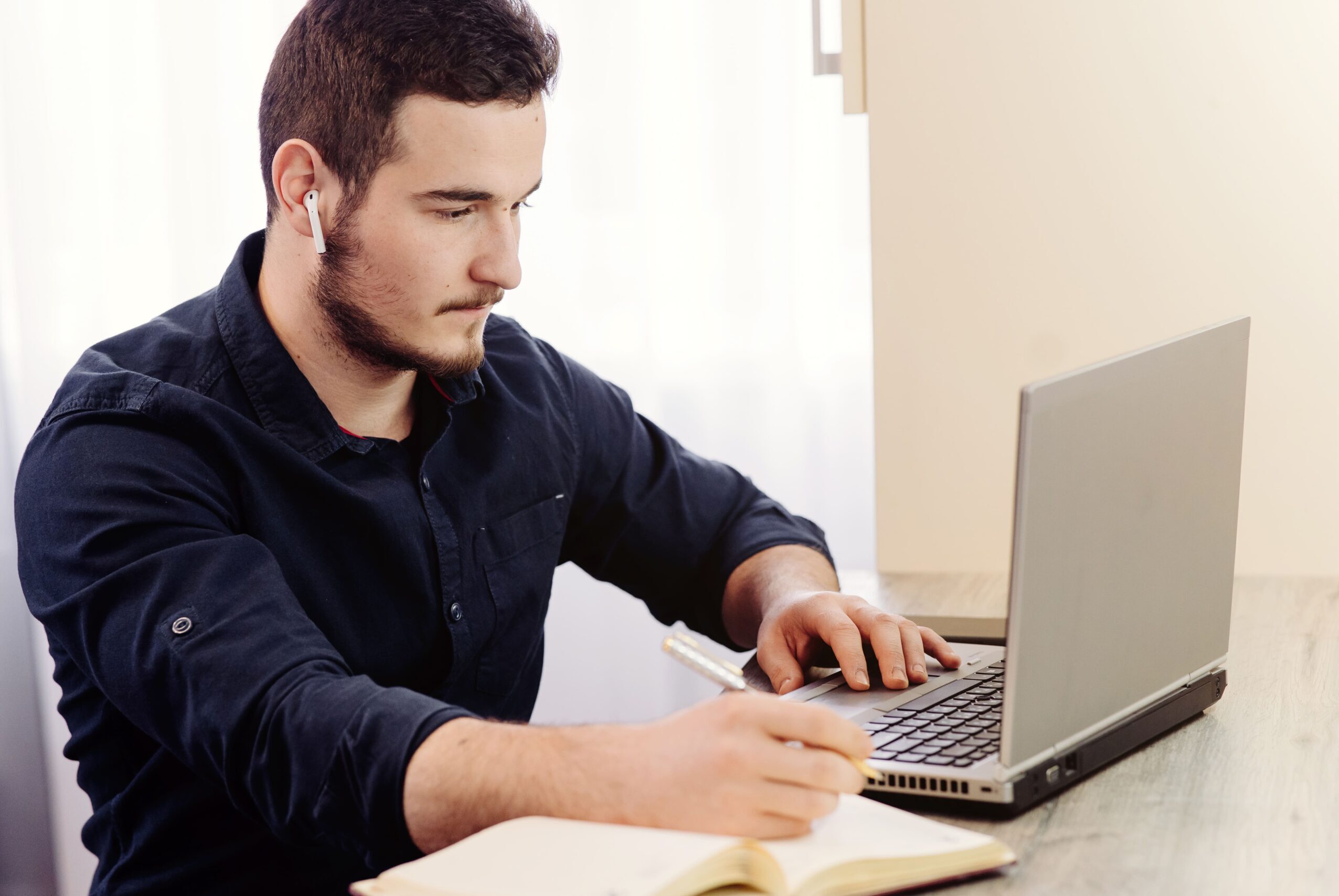 young-businessman-working-with-computer-remotely